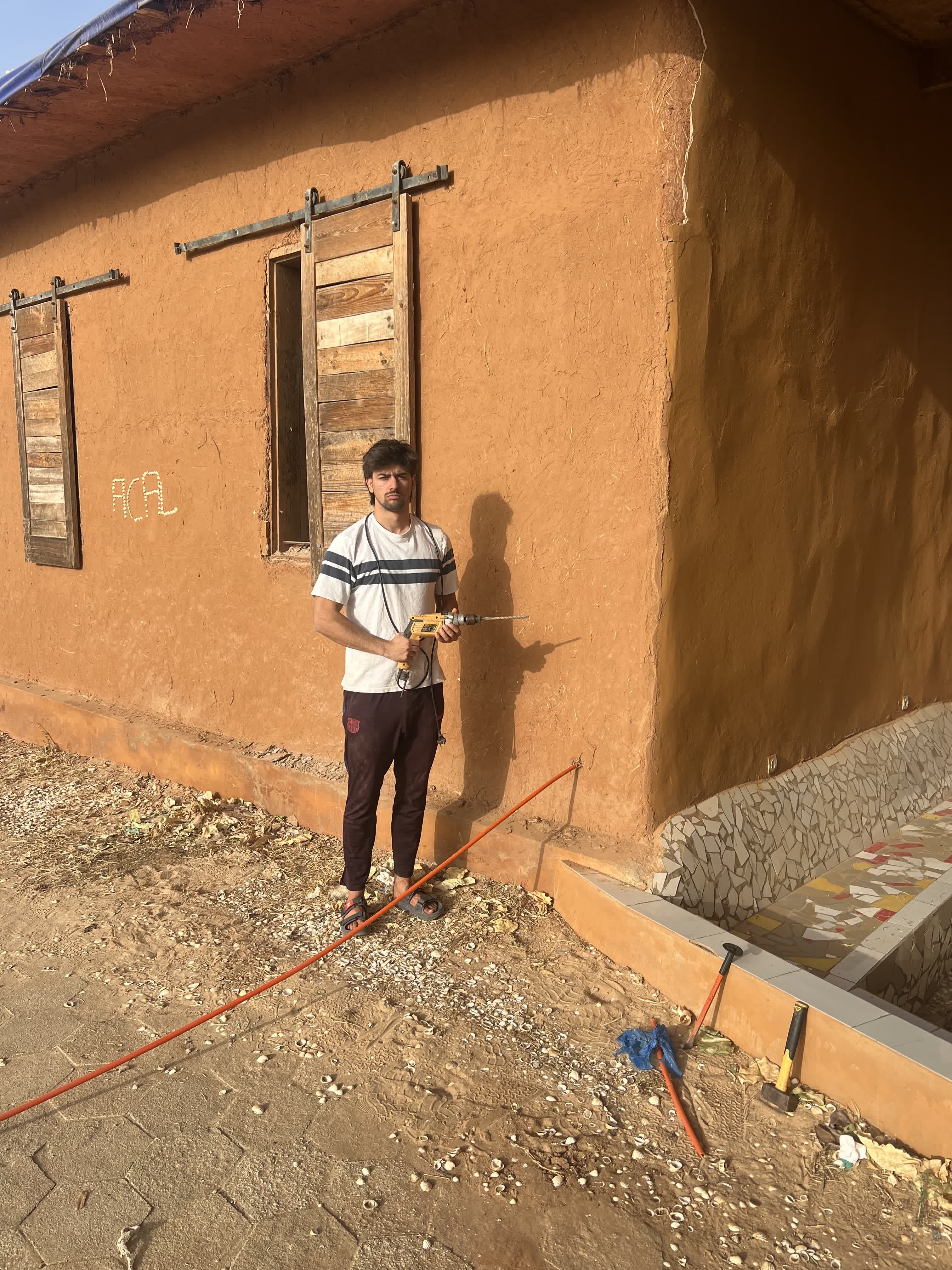 Jaume happy after drilling a hole for the cable